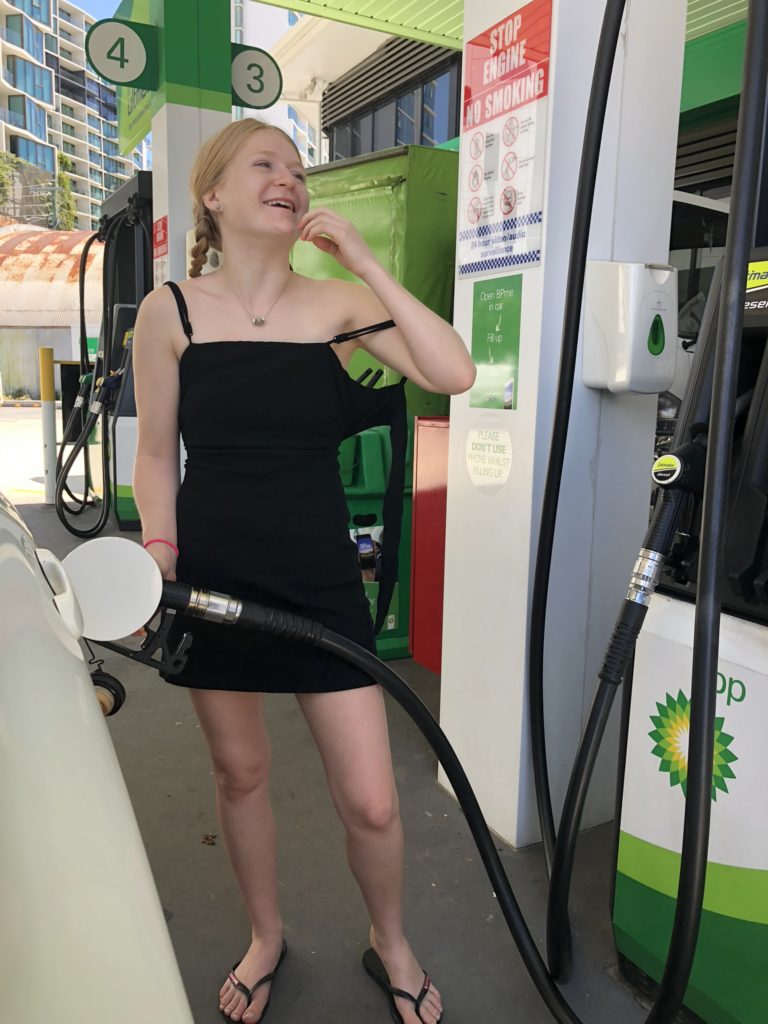 girl pumps gas on adventure drives